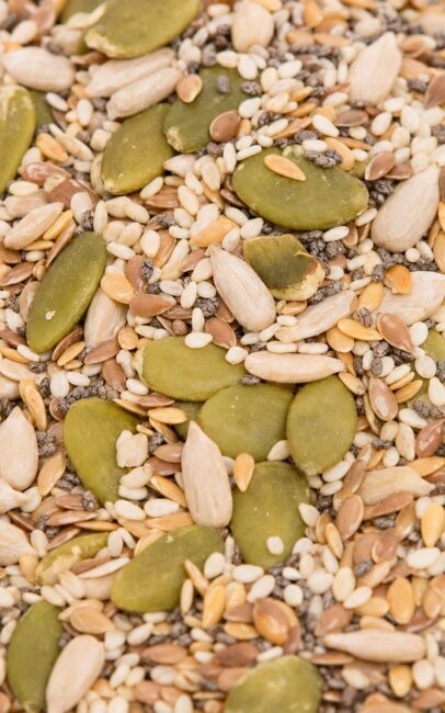 A close-up of a raw seed mix of pumpkin, sunflower, sesame, flax, and chia seeds