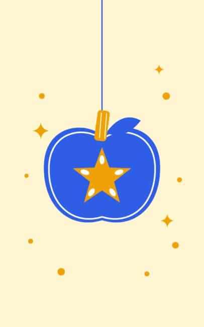 Blue apple ornament with a gold star, hanging from a cinnamon stick